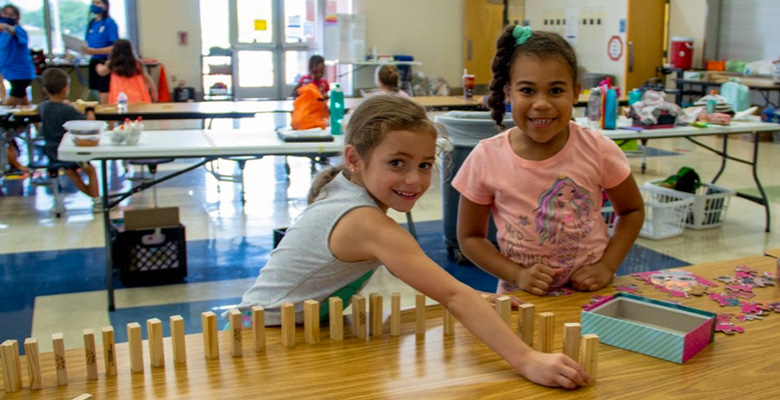 Two girls playing with blocks