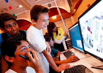Three middle school boys at a computer