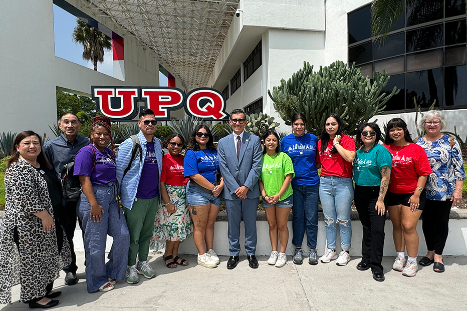 Chancellor, Dr. Mike Flores pictured with students